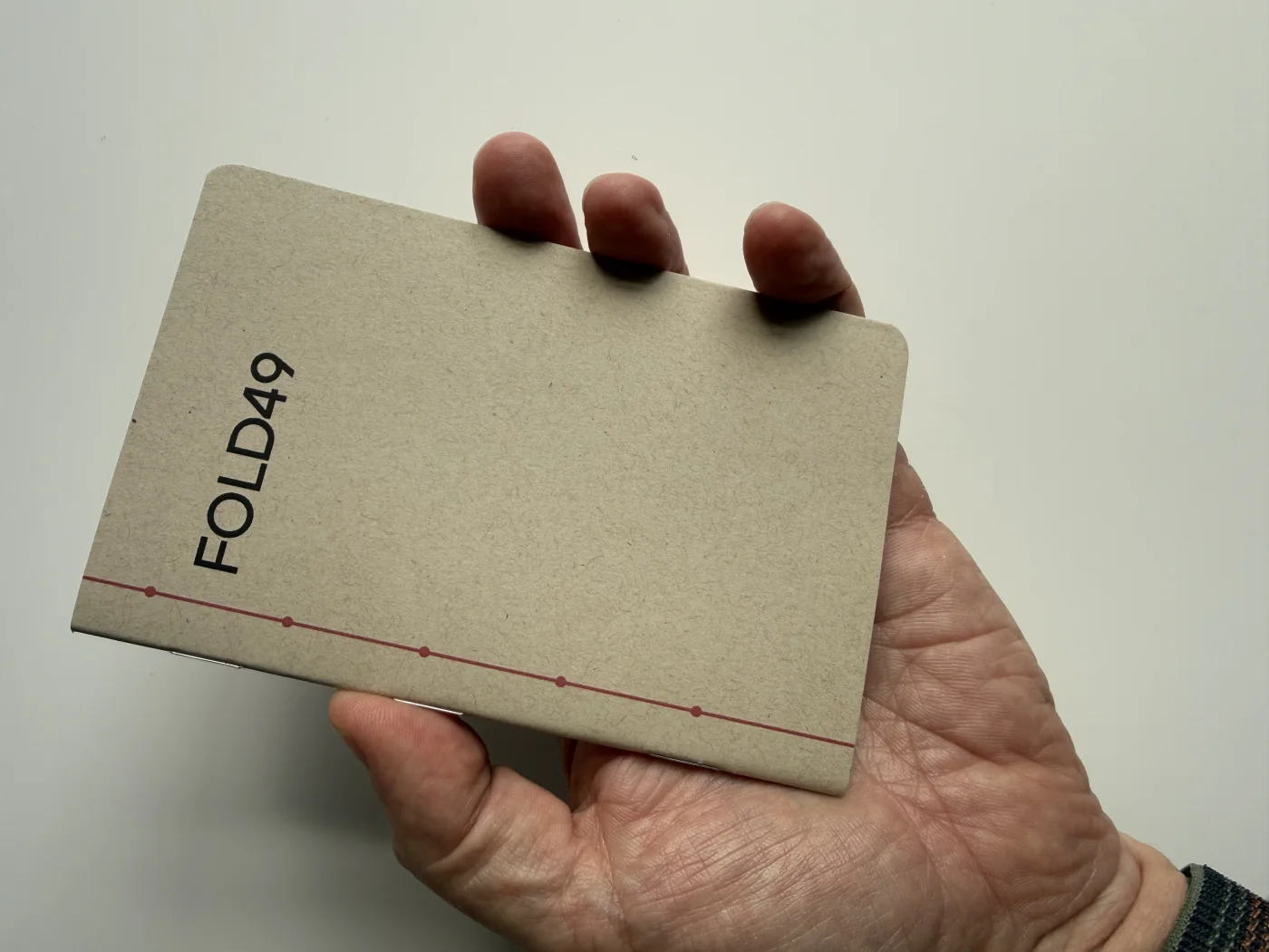 FOLD49 passport notebook held comfortably in one hand